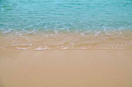 Soft wave of blue ocean on sandy beach. Background.の写真素材