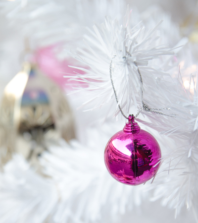 white christmas tree with ball ornament decoration on tree , copyspace for banner text or greetingの写真素材