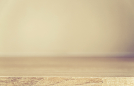 Wooden table on defocuced window with curtain backgroundの写真素材
