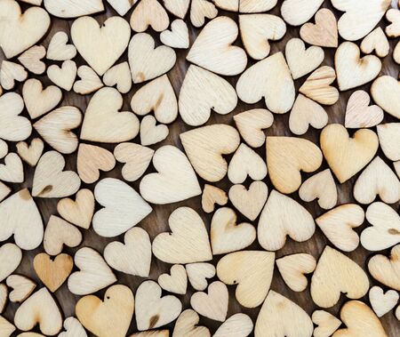 wood heart  on wood background, valentine concept with selective red heartの写真素材