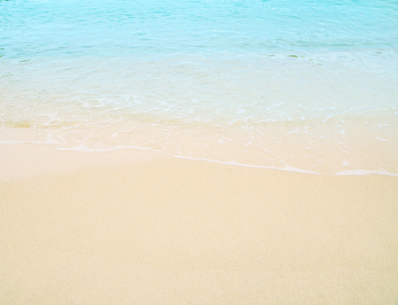Soft wave of blue ocean on sandy beach. Background.の写真素材