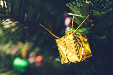 Christmas gift box  with gold ribbon  and copyspace for your greeting or wishesの写真素材