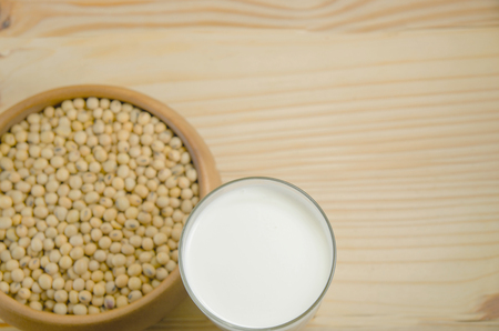 oy Milk with soy bean on wood bckgroundの写真素材