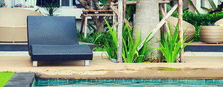 Relaxation with Rattan chair side swimming poolの写真素材