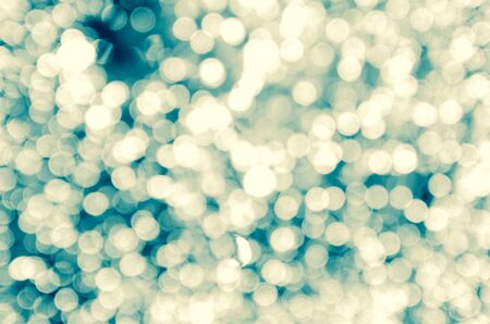 Decorative christmas background with bokeh lights and snowflakesの写真素材