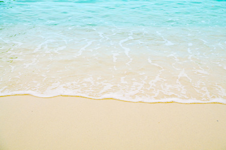 Soft wave of blue ocean on sandy beach. Background.の写真素材
