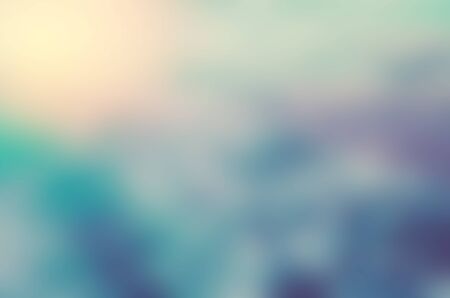 Blur sunset beach with bokeh sun light wave abstract background. Travel concept. Retro color style.の写真素材