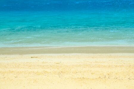 Soft wave of blue ocean on sandy beach. Background.の写真素材