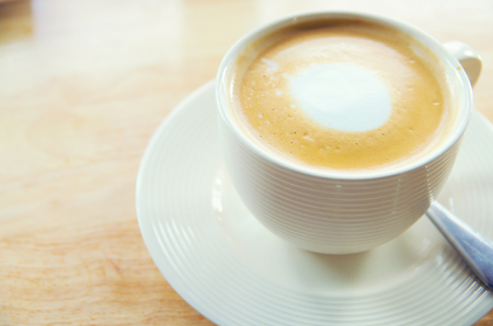 cup of coffee on table in cafeの写真素材