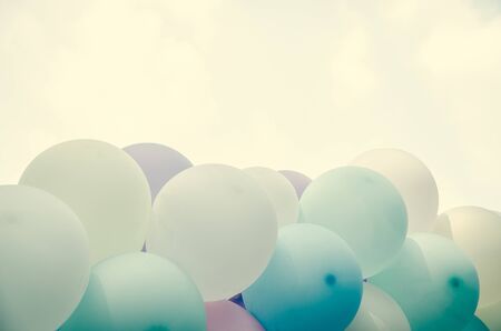 balloons background over pastel cloudの写真素材