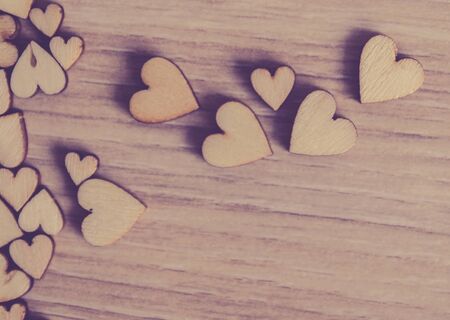 little wood heart  on wood background, valentine day concept with selective red heart  area , one loveの写真素材