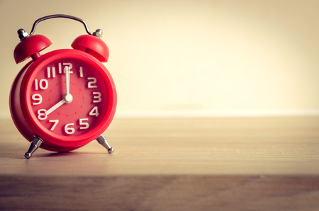 modern clock on wood table   , vintage processの写真素材