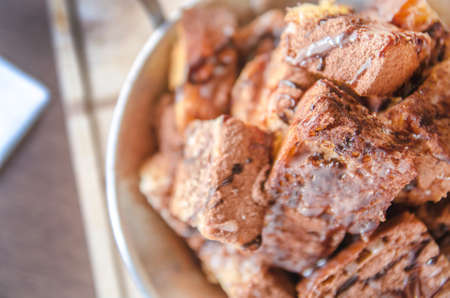 dessert - chocolat powder and bread on wood table in cafeの写真素材