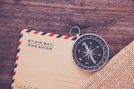 Vintage compass on the very old paper or letter envolopの写真素材