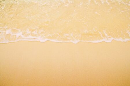 Soft wave of the sea on the sandy beachの写真素材
