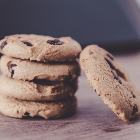 Chocolate chip cookies on old wooden tableの写真素材