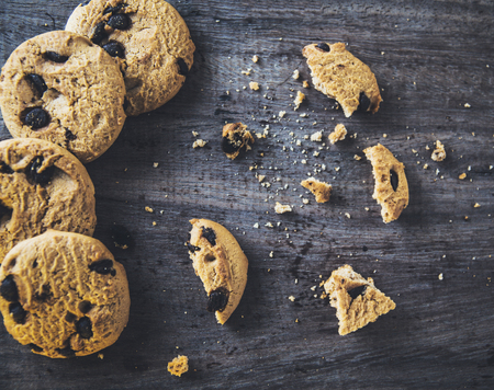 Chocolate chip cookies on old wooden tableの写真素材