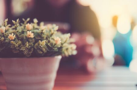dry flower in steel can decoration in coffee shop on wood tableの写真素材