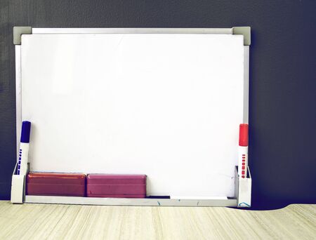 whiteboard and pen on tableの写真素材