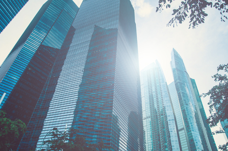 Modern business skyscrapers, high-rise buildings, architecture raising to the sky, sun. Concepts of financial, economics, future etc.の写真素材