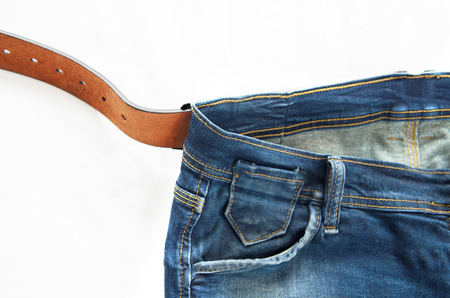 Blue jeans with old brown belt (man)の写真素材
