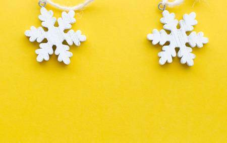 wooden snow flakes on paper backgroundの写真素材