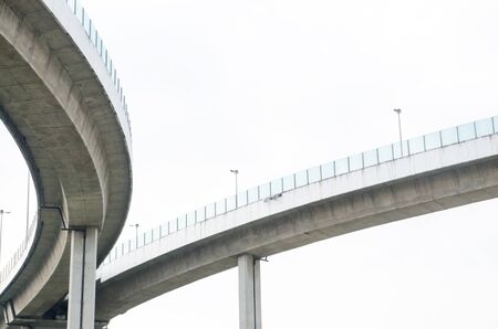 Elevated expressway . The curve of suspension bridge Large elevated traffic highway in Bangkok, Thailand.の写真素材