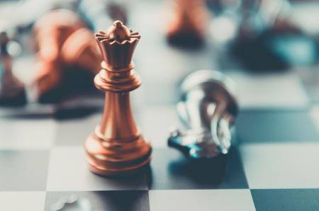 silver and gold knight on chess board. Chess knights head to head.Business concept opponent in business . or  Business Cooperationの写真素材