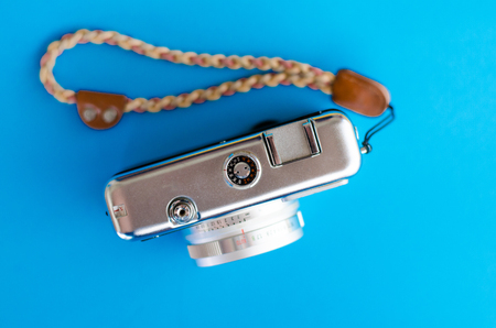 Top view of vintage camera on blue  background,の写真素材