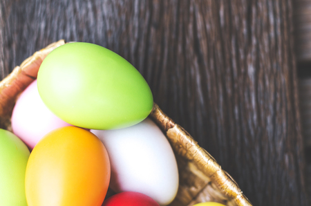 Easter eggs cute bunny. Funny happy in easter day on wood background の写真素材