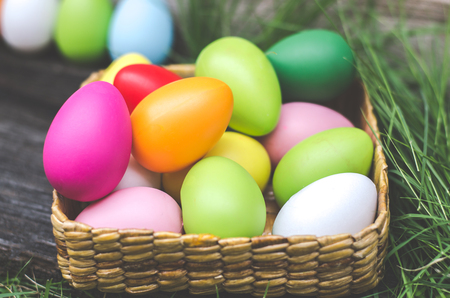 Easter eggs in grass against blurred green background. Spring holidays conceptの写真素材