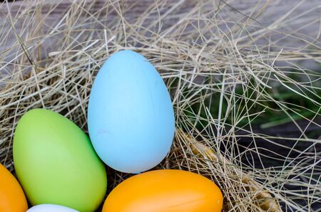Easter eggs in grass against blurred green background. Spring holidays conceptの写真素材
