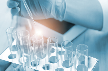 Vacutainer or test tube in lab on tableの写真素材