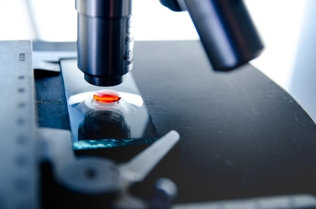 microscope and sample into a test tube,abstract science backgroundの写真素材