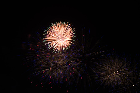 colorful fireworks on the black sky background over-waterの写真素材