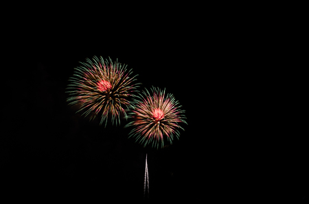 colorful fireworks on the black sky background over-waterの写真素材