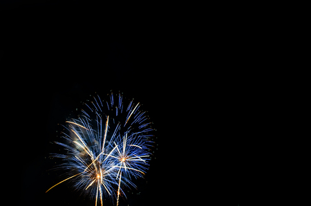 colorful fireworks on the black sky background over-waterの写真素材
