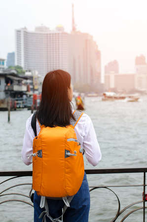 travel and adventure concept from beautiful black long hair photographer asian girl with her camera travel and take photoの写真素材