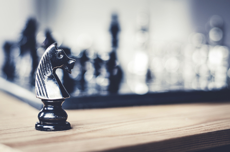 Detail of a hand making the first move in a chess game, moving the pawn one field forward. Selective focusの写真素材