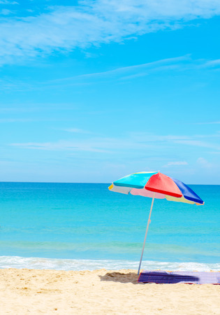umbrella beach white sand and blue skyの写真素材