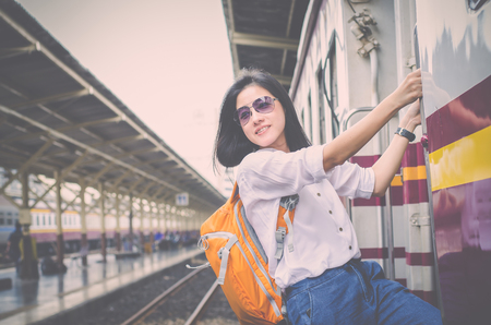 travel and adventure concept from beautiful black long hair photographer asian girl with her camera travel and take photoの写真素材