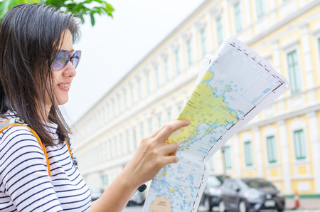 travel and adventure concept from beautiful black long hair photographer asian girl with her camera travel and take photoの写真素材