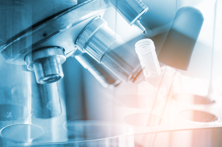 A pipette dropping sample into a test tube,abstract science backgroundの写真素材