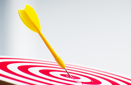 target dart pin on center 10 point dartboard  Marketing concept.の写真素材