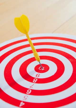 target dart pin on center 10 point dartboard  Marketing concept.の写真素材