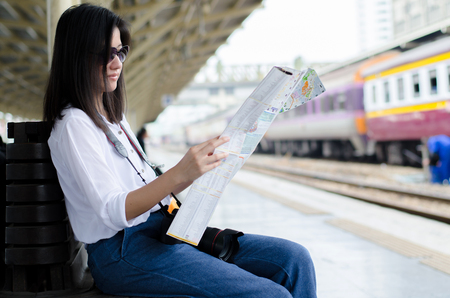 travel and adventure concept from beautiful black long hair photographer asian girl with her camera travel and take photoの写真素材