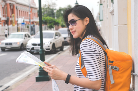 travel and adventure concept from beautiful black long hair photographer asian girl with her camera travel and take photoの写真素材