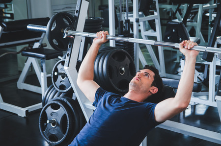 man pickup dumbell in gym . exercise with work out program for healthyの写真素材