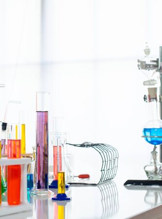 A pipette dropping sample into a test tube,abstract science backgroundの写真素材
