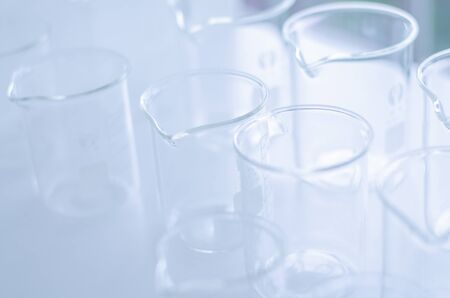 A pipette dropping sample into a test tube,abstract science backgroundの写真素材